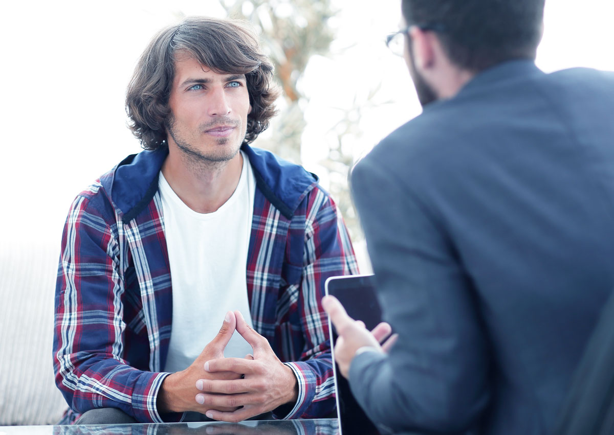 man talking to a psychologist getting professional help
