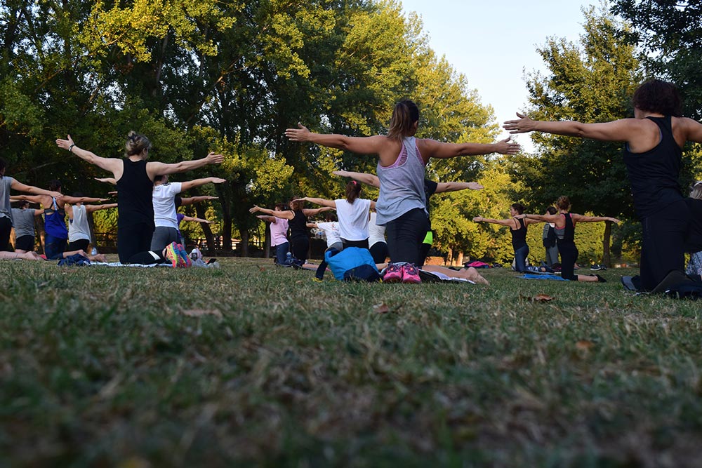 community doing yoga exercises